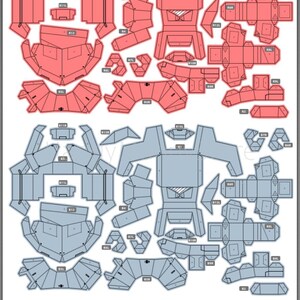 Pu&ograve; includere: Un diagramma di modelli di papercraft rossi e blu, con varie forme geometriche. I modelli sono progettati per essere ritagliati e assemblati in modelli 3D. Due sfere verdi e lucide sono in basso.