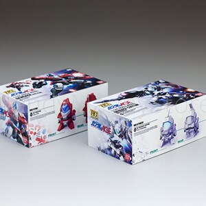 May include: Two white boxes with colorful illustrations of robots and Japanese text. The boxes have images of red, blue, and purple robots. The boxes are labeled "HG" and "Gundam AGE".