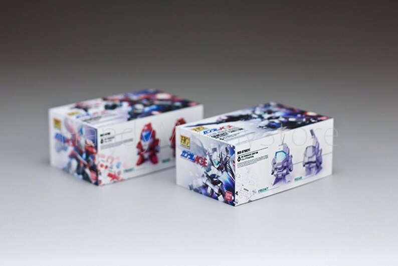 May include: Two white boxes with colorful illustrations of robots. The boxes have Japanese text and images of robot figures. The boxes are on a white surface.