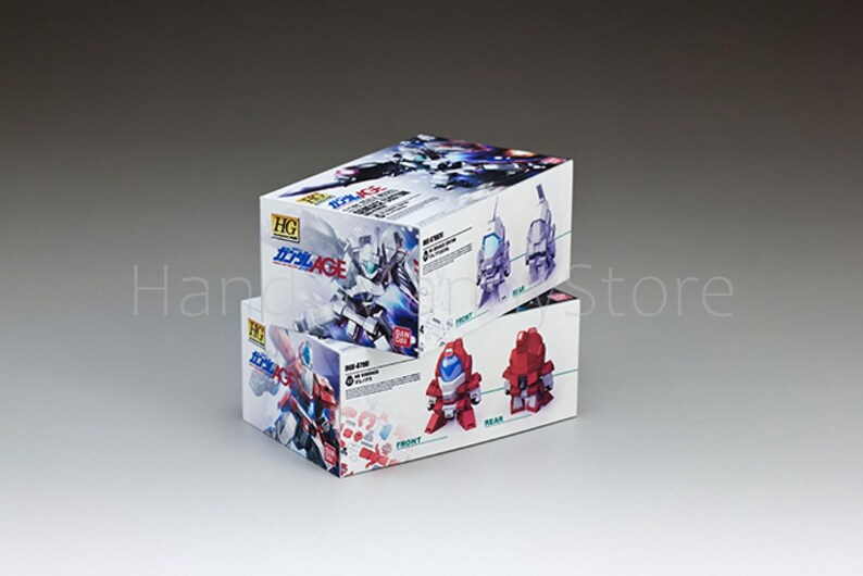 May include: Two stacked white boxes featuring illustrations of robots and text in Japanese. The boxes have the HG logo and the text "Gundam AGE". One box shows a red robot, the other a blue and white robot.