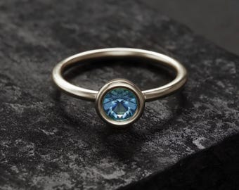Blue Topaz Ring: Sterling Silver Faceted Stone - Classic Minimal Style