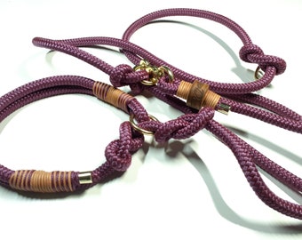 May include: Burgundy rope dog collar and leash set with gold hardware and brown leather accents. The leash has a slip knot and the collar has a metal ring.