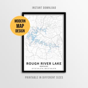 May include: A framed map print of Rough River Lake in Kentucky, featuring light blue water paths against a white background with black road lines. The text reads ROUGH RIVER LAKE, KENTUCKY, and the coordinates 37°37'44.3"N | 86°27'55.6"W.