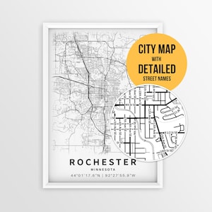 May include: A framed black and white city map of Rochester, Minnesota, featuring detailed street layouts and coordinates. A circular inset highlights specific street names, accompanied by a yellow circle with the text CITY MAP WITH DETAILED STREET NAMES.