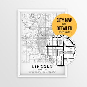 May include: A framed black and white city map of Lincoln, Nebraska, featuring a detailed street grid and coordinates. A circular inset highlights specific street names like Washington St and Everett St. Text reads CITY MAP WITH DETAILED STREET NAMES.
