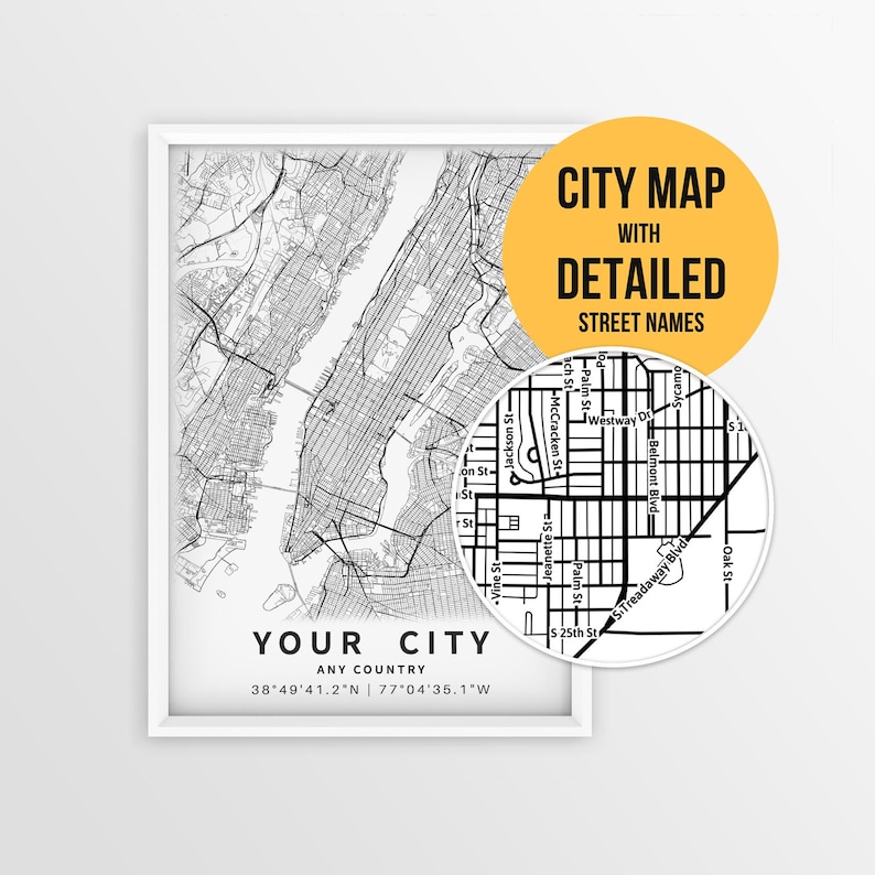 May include: A framed black and white city map print with detailed street names. The map shows a city layout with a close-up view of a section of the map. The text on the print reads "YOUR CITY" and "ANY COUNTRY".