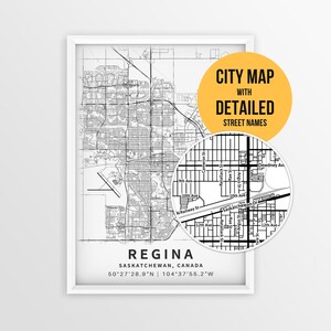 May include: A framed black and white map of Regina, Saskatchewan, Canada, featuring street grids and coordinates. A circular inset shows a zoomed-in view of street names. A yellow circle contains the text CITY MAP WITH DETAILED STREET NAMES.