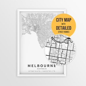 May include: A framed black and white map of Melbourne, Australia, featuring a detailed street grid. A circular inset shows a zoomed-in view of city streets with labels. Text reads: CITY MAP WITH DETAILED STREET NAMES, MELBOURNE, AUSTRALIA, 37°50'15.3"S | 144°57'01.1"E.