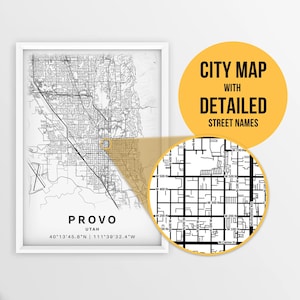 May include: A black and white city map of Provo, Utah with detailed street names. The map shows the city's layout with streets, roads, and landmarks. The map is framed in a white frame.