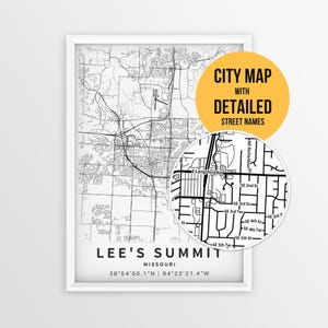 May include: A framed black and white map print of Lee's Summit, Missouri, featuring street layouts, coordinates, and a circular inset showing detailed street names. A yellow circular overlay contains the text CITY MAP WITH DETAILED STREET NAMES.
