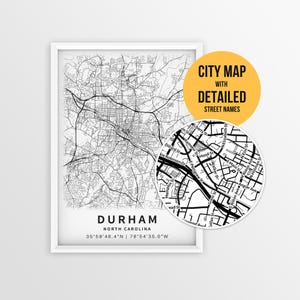 May include: A framed black and white city map of Durham, North Carolina, with detailed street names. A circular inset highlights a close-up of the street layout. The text "CITY MAP WITH DETAILED STREET NAMES" is in a yellow circle.