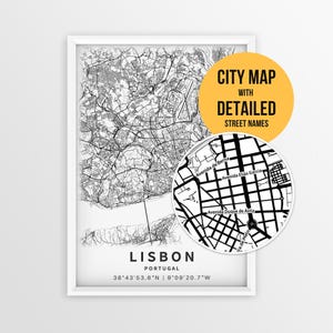 May include: A framed black and white map of Lisbon, Portugal, featuring intricate street networks and coordinates. A circular inset shows a magnified view of street names like Avenida de Berna. A yellow circle contains the text CITY MAP WITH DETAILED STREET NAMES.