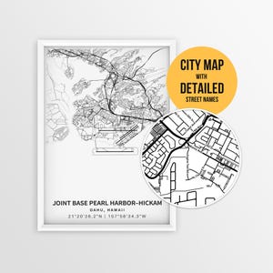 May include: A framed monochrome city map of Joint Base Pearl Harbor-Hickam, Oahu, Hawaii. The map features detailed street names and coordinates. A circular inset highlights a section of the map.