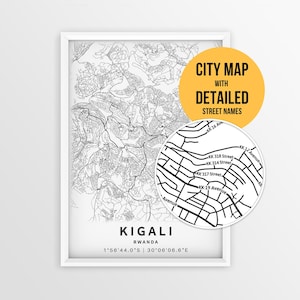 May include: A framed black and white map of Kigali, Rwanda, featuring detailed street lines and names. A circular inset highlights specific street labels like KK 318 Street. The text reads CITY MAP WITH DETAILED STREET NAMES, KIGALI, RWANDA, and coordinates.