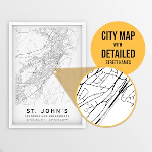 May include: A black and white city map of St. John's, Newfoundland and Labrador, with detailed street names. The map shows the city's layout, including roads, waterways, and landmarks. The map is framed in a white frame.