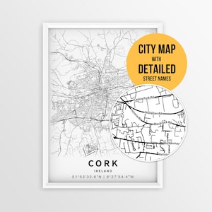 May include: A framed black and white map print of Cork, Ireland, featuring street layouts and coordinates. A circular inset highlights detailed street names like Victoria Rd and Blackrock Rd, with a yellow badge stating CITY MAP WITH DETAILED STREET NAMES.