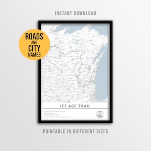 May include: A framed map print of the Ice Age Trail in Wisconsin, USA. The map features roads, city names, and elevation details. The print is in black and white, with a black frame. Text on the print includes "Instant Download" and "Printable in Different Sizes."