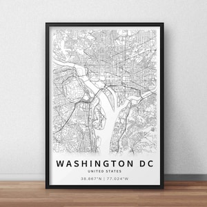 May include: A framed black and white map print of Washington DC, United States. The map details the city's layout, including streets, waterways, and landmarks. The text "WASHINGTON DC UNITED STATES" is displayed at the bottom, along with the coordinates 38.867&deg;N | 77.024&deg;W.