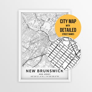 May include: A framed black and white map print of New Brunswick, New Jersey, featuring a circular inset showing detailed street names. The text reads NEW BRUNSWICK, NEW JERSEY, 40 29'21.4"N | 74 26'38.0"W, and CITY MAP WITH DETAILED STREET NAMES.