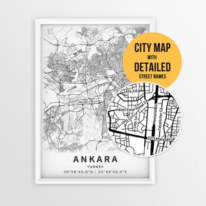 May include: A framed black and white map print of Ankara, Turkey, featuring detailed street layouts and coordinates. A circular inset highlights specific street names like Hasan Celal Güzel Cd. and Mevlana Blv. with a yellow overlay text.