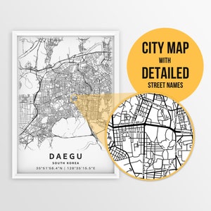 May include: A black and white city map of Daegu, South Korea, with detailed street names. The map shows the city's layout and major roads. The text "DAEGU" and "SOUTH KOREA" is printed in black at the bottom of the map. The coordinates "35°51'58.4"N | 128°35'15.5"E" are printed below the text.
