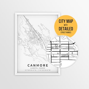 Puede incluir: Un mapa de la ciudad de Canmore, Alberta, Canadá, en blanco y negro, con nombres de calles detallados, enmarcado en un marco blanco. El mapa incluye las coordenadas 51°05'05.5"N 115°20'59.9"W. Una inserción circular resalta los detalles de las calles.