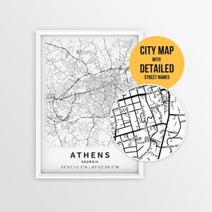 May include: A framed black and white city map of Athens, Georgia, with a detailed street map. A circular inset highlights street names. The text "CITY MAP WITH DETAILED STREET NAMES" is in a yellow circle.