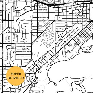 May include: A black and white street map illustration featuring a grid of roads and neighborhood blocks. A circular yellow badge with the black text SUPER DETAILED is overlaid on the lower left section of the map, highlighting the layout.