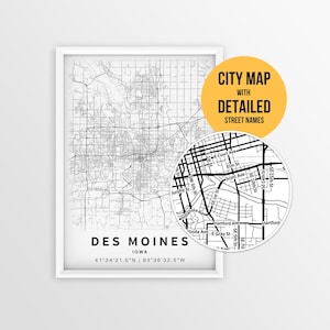May include: A framed black and white city map of Des Moines, Iowa, with detailed street names. The map includes the city's coordinates and a close-up view highlighting street details. The text "CITY MAP WITH DETAILED STREET NAMES" is displayed.