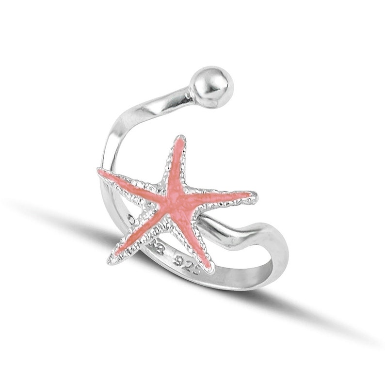 a silver ring with a starfish on it