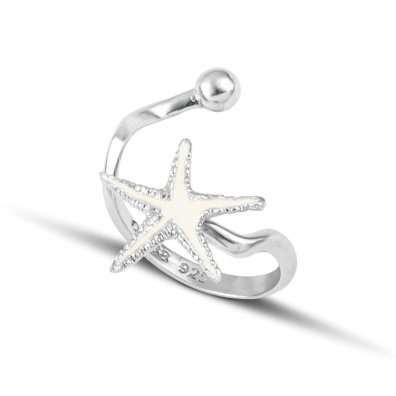 a silver ring with a starfish on it