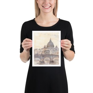 Peut inclure: Une peinture &agrave; l'aquarelle de la basilique Saint-Pierre de Rome, en Italie. La peinture repr&eacute;sente le d&ocirc;me et la fa&ccedil;ade de la basilique, ainsi que le pont devant elle. La peinture est r&eacute;alis&eacute;e dans des tons de gris et de blanc, sur un fond jaune clair.
