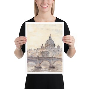 Peut inclure: Une peinture &agrave; l'aquarelle de la basilique Saint-Pierre de Rome, en Italie. La peinture repr&eacute;sente le d&ocirc;me et la fa&ccedil;ade de la basilique, ainsi qu'un pont au premier plan.