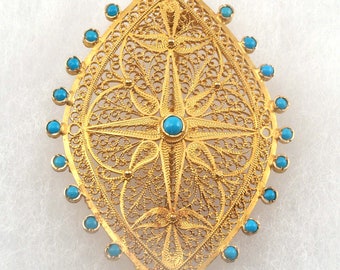 Handmade high karat gold filigree brooch with turquoise accents