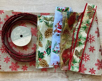 May include: A collection of Christmas craft supplies including a roll of red and gold glitter ribbon, a roll of white and gold crepe paper ribbon, a roll of green and gold ribbon with a pine cone design, a roll of red and gold ribbon with a snowflake design, and a roll of burlap fabric with a red snowflake design. The ribbon rolls are labeled "Creped Finsel Ribbon" and "10 Feet 25¢".