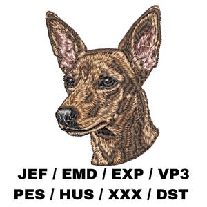 May include: Embroidered dog head with brown and tan fur, featuring upright ears and a detailed snout. The image includes text at the bottom: JEF / EMD / EXP / VP3 PES / HUS / XXX / DST.