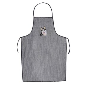 May include: A gray denim apron with black adjustable straps and a black embroidered image of a husky dog on the front.