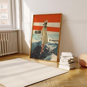 Peut inclure: Une affiche de style vintage avec une femme debout sur un sommet de montagne enneigé. Le visage de la femme est caché par un bouquet de fleurs. L'affiche a un fond rayé rouge et blanc avec le texte "AGAIN" et "It's amazin'" en noir.