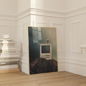 May include: A framed print of a surreal landscape with a person standing on top of an old computer monitor. The computer is on a rocky hill with a window in the background.