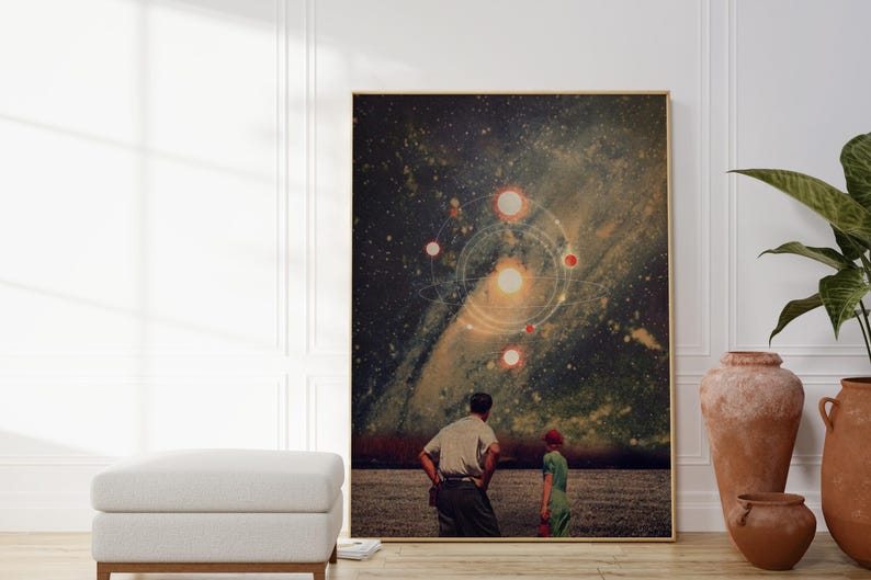 May include: A digital art print featuring a couple standing in a field, looking up at a starry night sky with a galaxy and multiple planets. The print has a vintage aesthetic.