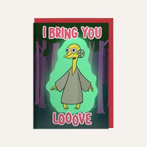 May include: A greeting card featuring a cartoon character in a woodland setting. The character is yellow with a long neck and large eyes. The card reads "I bring you looove".