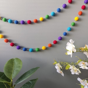 Intense rainbow garland of felt balls in merino wool, multicolored colorful pompom garland