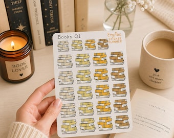 May include: A white sticker sheet titled Books 01 by Empire Sticker Planner featuring twenty-four individual illustrations of stacked books in varying shades of yellow, gold, and brown, arranged in a grid pattern on a rectangular white backing.