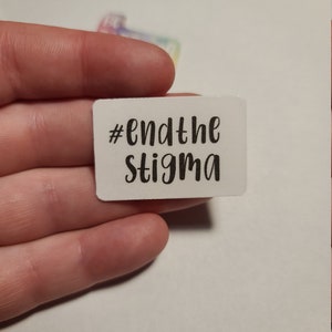 May include: White sticker with black text that reads "#endthestigma".