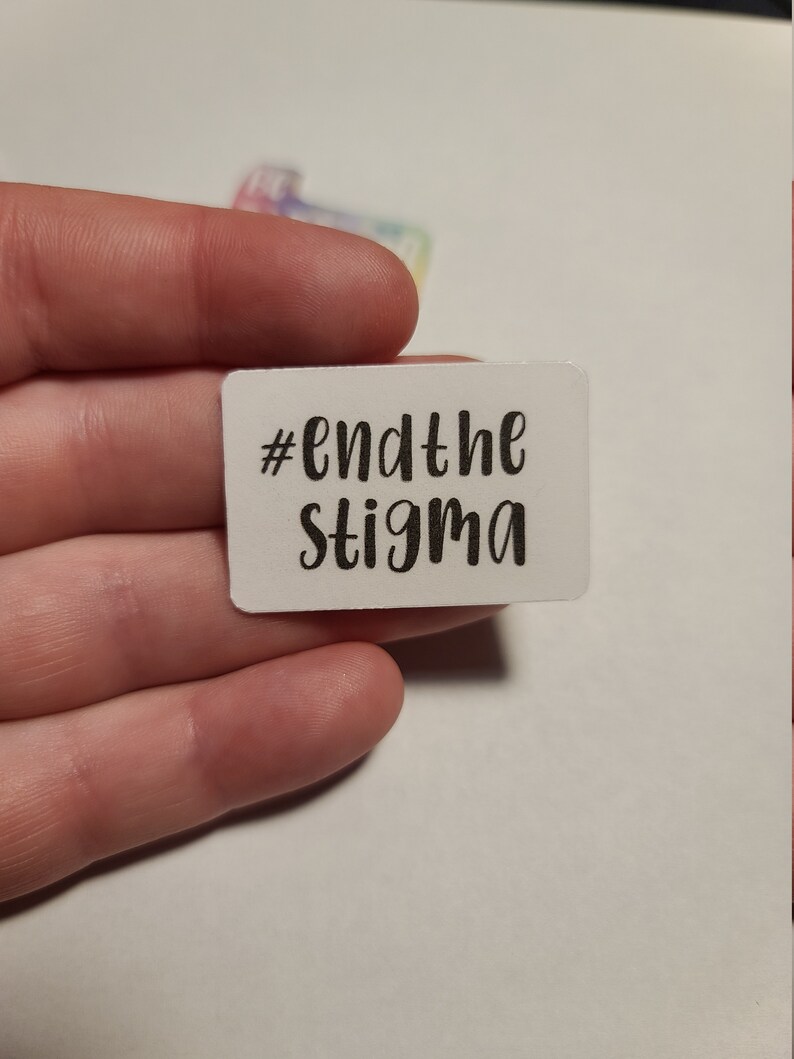 May include: White sticker with black text that reads "#endthestigma".