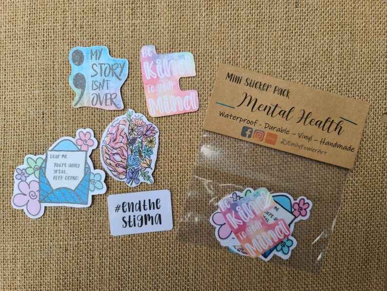 May include: A pack of mini stickers with mental health awareness themes. The stickers feature watercolor designs with phrases like "My story isn't over", "Be kind to your mind", and "#endthestigma".
