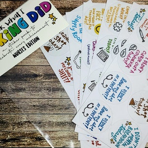 May include: A sticker pack with a white background and colorful text that reads "Look what I F*CKING DID" with a rainbow design. The sticker pack is labeled "Nurses Edition" and includes a variety of stickers with humorous phrases related to the nursing profession.