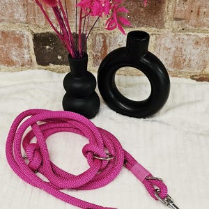 May include: A set of three ceramic mugs with a speckled, matte finish. The mugs are in shades of cream, light gray, and dark gray. Each mug has a simple, minimalist design, perfect for coffee or tea.