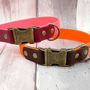 Two Trinkety Paws two-coloured waterproof Biothane Dog Collar, with antique Brass Fast Release Buckle and Fittings, in Baby Pink and Brown on the left and Orange and Dark Brown on the right side.