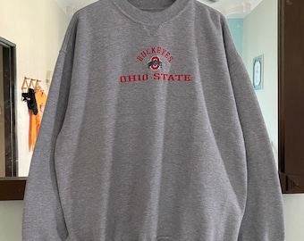 May include: Gray sweatshirt with a red embroidered logo that says "Buckeyes" and "Ohio State".